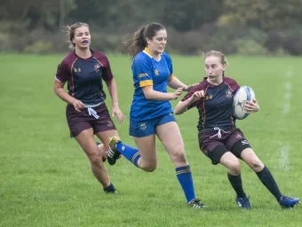 Team Southampton escape a tackle in ladies' rugby match.