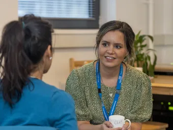 Adviser and student in conversation. 