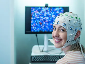 A student wearing an EEG cap.