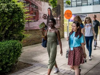A student shows a group of visitors around Highfield campus