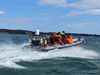 Powerboat moving away from the camera