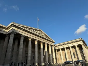 The front of the British Museum on a sunny day. 