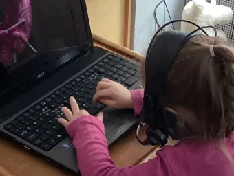 Early Years Centre child using laptop