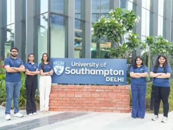 Five students stood outside the entrance to the University of Southampton's Delhi campus.