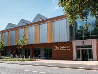The outside view of the Jubilee Sports Centre on a sunny day.