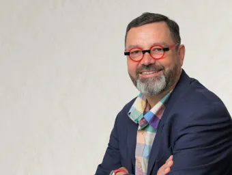 Hans Michael Haitchi looking directly at the camera, wearing funky glasses.