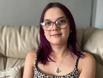 Imogen smiles at the camera