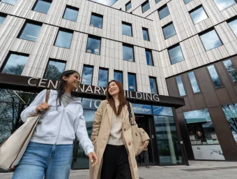 Students walking outside the Centenary Building on the University of Southampton Highfield Campus.