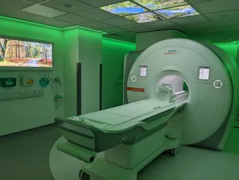 An MRI scanner bathed in green light