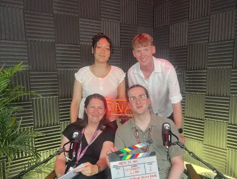 The four podcast members for episode 9 gathered together and looking into the camera for a photo.