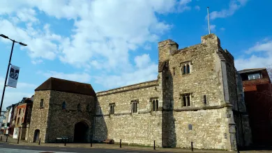 Outside view of the grey stone walls of God's Tower.