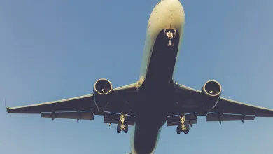 A large passenger plane flying close overhead