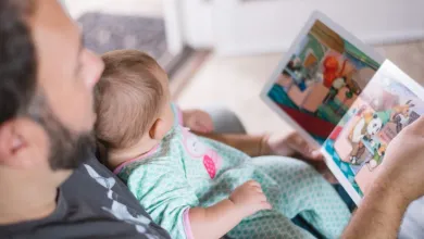 Father reading a book to his baby