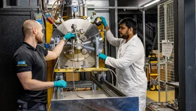 Researchers working with testing equipment