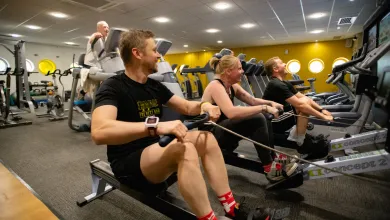 Gym user rowing