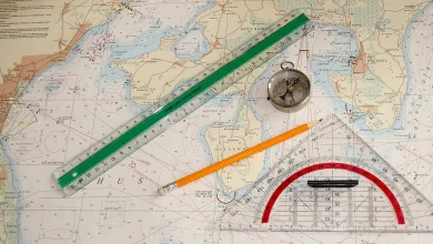 Nautical chart with a pencil, ruler and compass on it