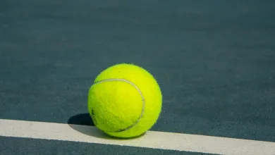 Tennis ball on tennis court