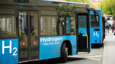 Two blue buses powered by hydrogen cell fuel