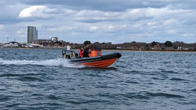 Powerboat with instructor and student out on the water