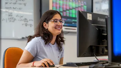 Navya Gulati working at a computer station