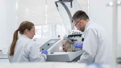 Scientists working on lap equipment