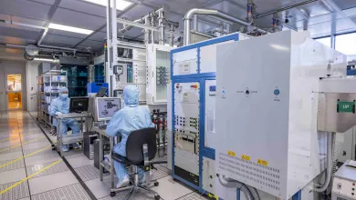 Researchers wearing cleanroom suits in the nanofabrication cleanrooms 