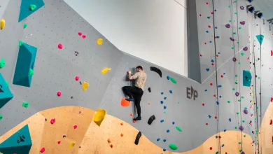A climber climbing up Southampton University's indoor climbing wall