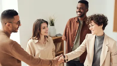 group of people shake hands