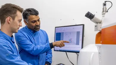 Professor Sumeet Mahajan and student at a computer