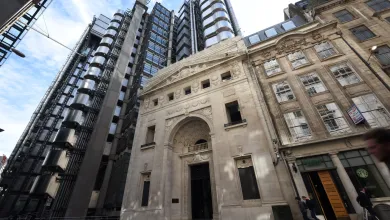 Exterior of the Lloyd's  building showing both the modern and historic buildings