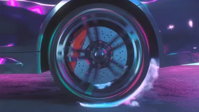 Close-up of a car wheel in motion, showing a spinning brake disc and caliper with visible brake dust and smoke.