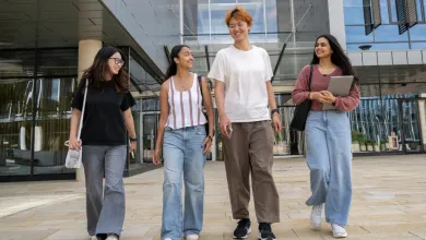 A group of students walking together on campus.
