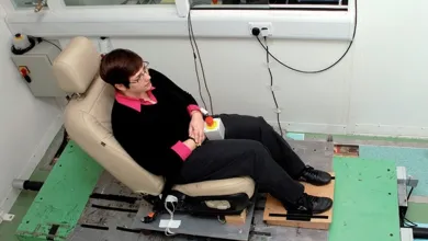 Participant seated on a horizontal vibration test rig used to study human response to whole-body vibration