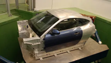 Vehicle body mounted on a six-axis motion simulator for vibration and ride dynamics testing