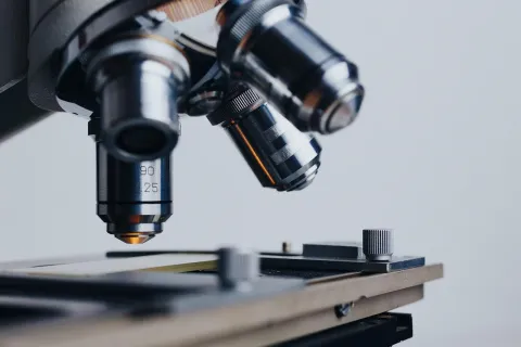 Microscope lens positioned above a slide