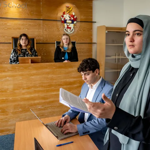Law students participating in a moot court session.