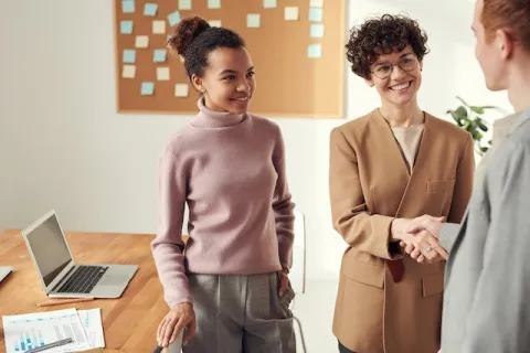 image of people in the workplace shaking hands