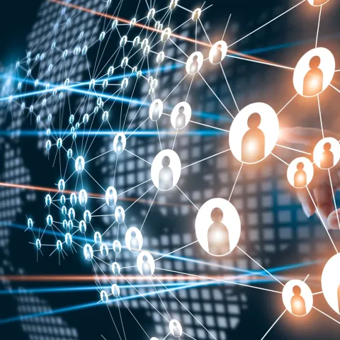 A hand interacting with a digital network of connected person icons over a world map background.