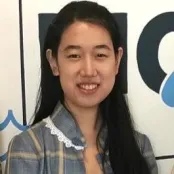 Portrait image of economics student smiling at the camera.