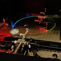 A gas-filled hollow core optical fibre scatters a spectrum of colours.