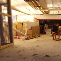 The storage space at Winchester Gallery, with a chair in the centre of the room.