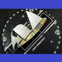 Scale sailing yacht model mounted on a turntable for aerodynamic testing in a wind tunnel